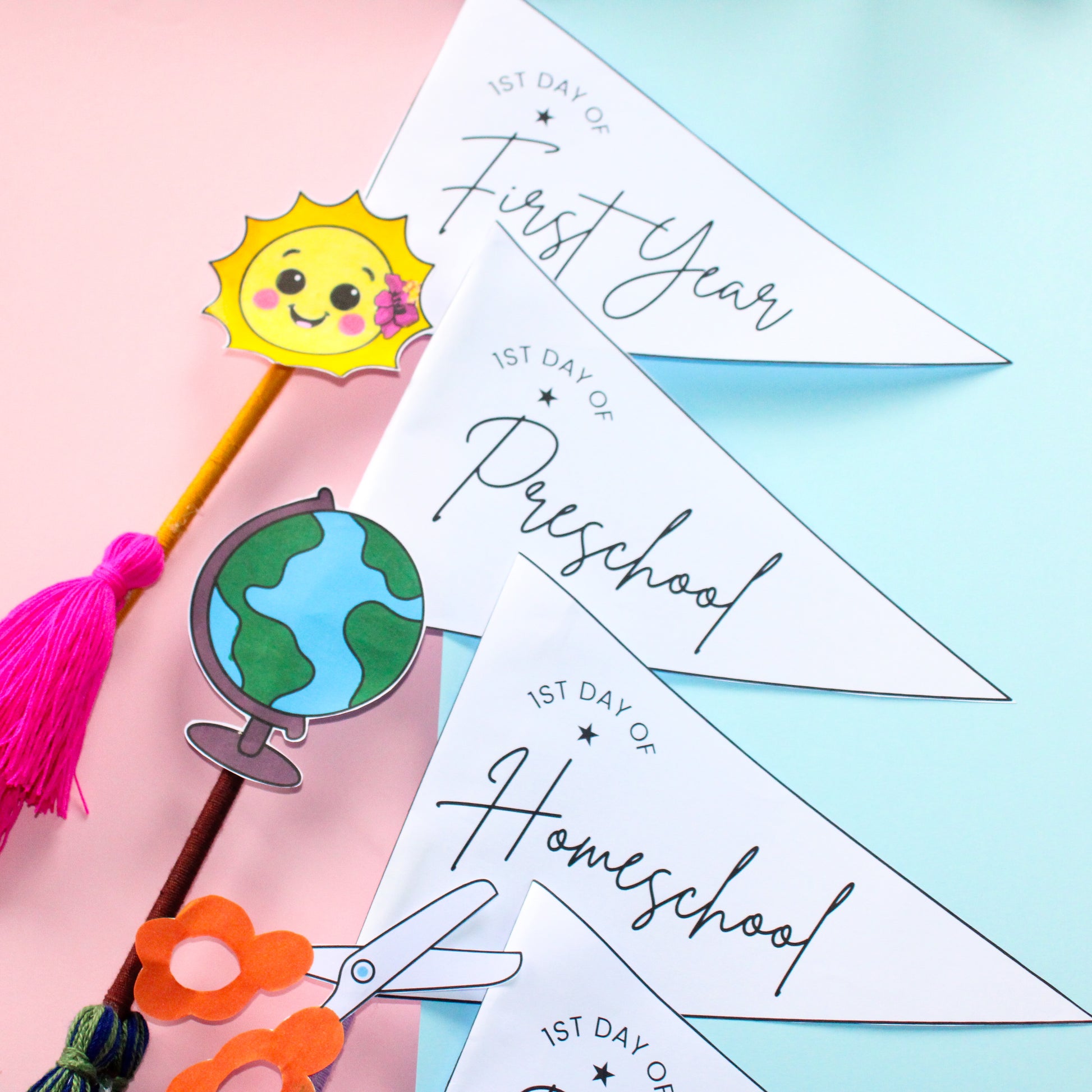 Decorative pennant flags for marking the first day of school on a colorful background