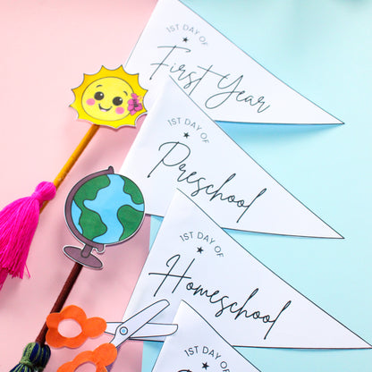 Decorative pennant flags for marking the first day of school on a colorful background